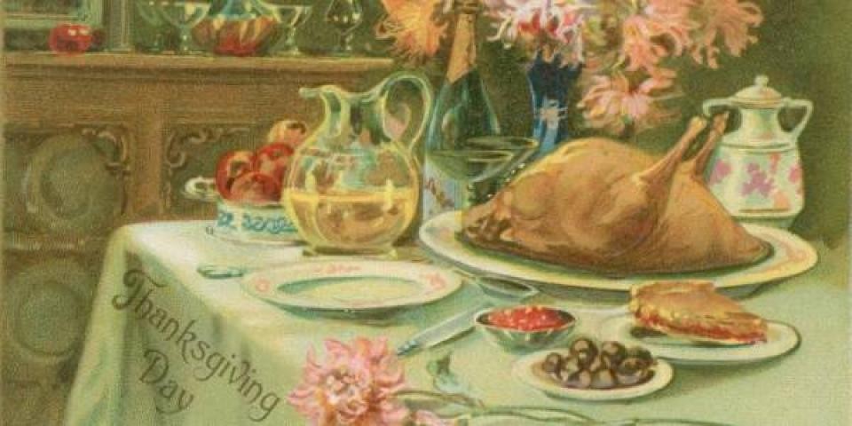 vintage postcard showing illustration of a Thanksgiving feast on a table