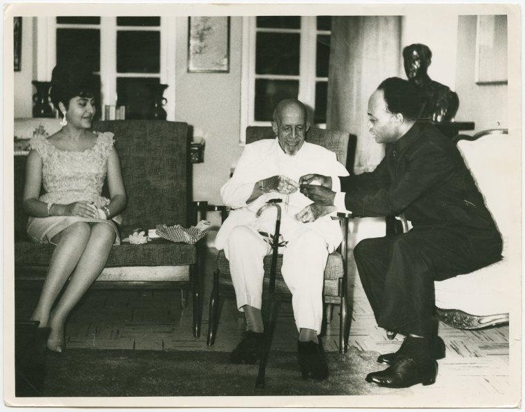 Kwame Nkrumah and his wife, Fathia, presenting a gold watch to W.E.B. DuBois on the occasion of his 95th birthday, Feb. 23, 1963