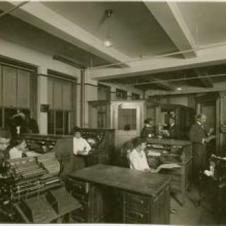 View of researchers using the Schomburg Collection, when it was the 135th Street Branch Library Division of Negro Literature, History and Prints, as it looked in 1938, with Catherine A. Latimer, reference librarian of the collection, in left background.