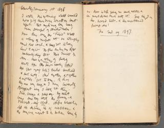 A diary entry dated Saturday, January 1st, 1898 lays open to two handwritten pages ending with the underlined phrase, "The end of 1897".