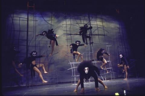 Stage featuring dancers in masks.