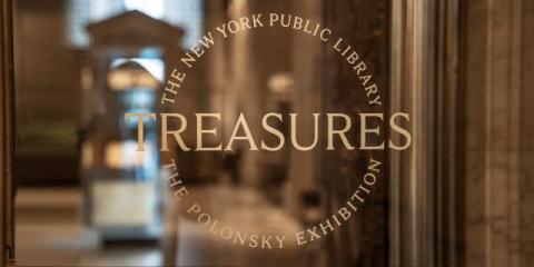 Glass door showing the Treasures logo in gold text.