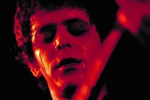 Image of Lou Reed performing at a concert 